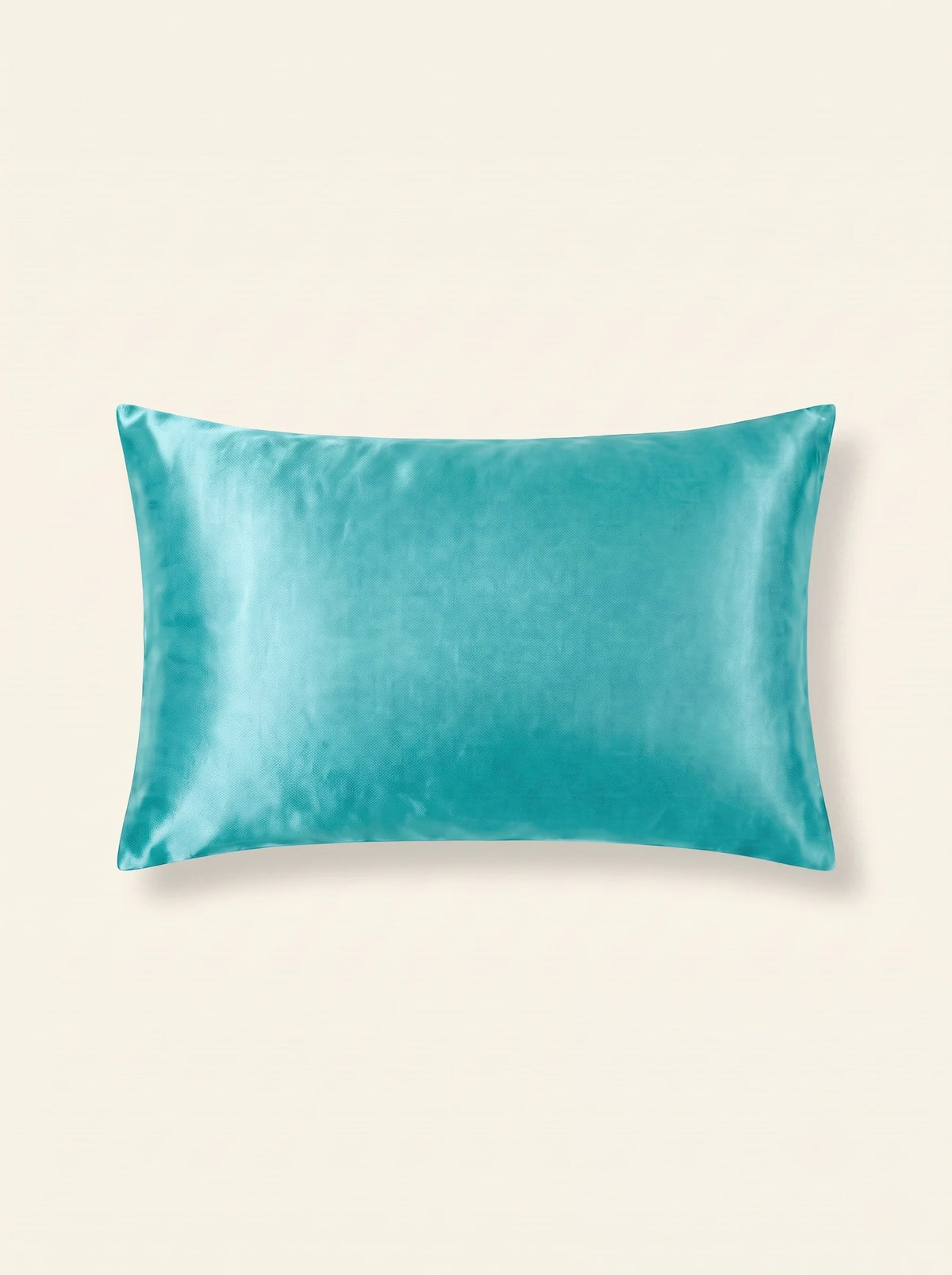 Taie d'oreiller en soie 25 mommes turquoise sur fond ivoire.